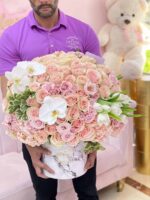 Round box with pink and purple flowers