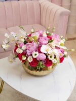 Sarah arrangement of pink and white roses in a round box