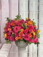 Vase filled with red and orange roses