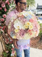 Iris arch arrangement with pastel blooms