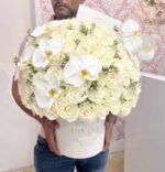 Round box with white and cream blooms