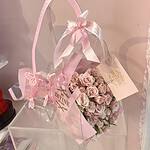 Bouquet presented in a transparent Divine carry bag