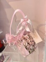 Bouquet presented in a transparent Divine carry bag