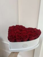 Heart shaped white box packed with red roses