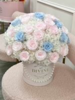 Preserved roses in soft blue and white tones