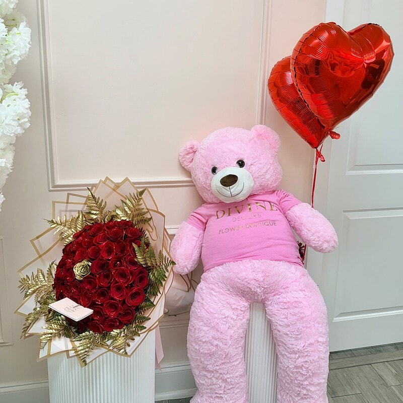 Grand Rose Bear bouquet of red roses paired with an oversized teddy bear