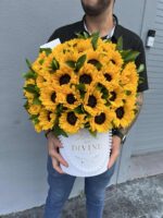 Box packed with fresh sunflowers