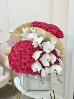 La Madame arrangement with magenta and white roses