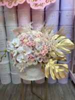 Boho Glam hat box with neutral blooms and gold palm accents