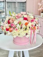 Large box arrangement with pink and white flowers