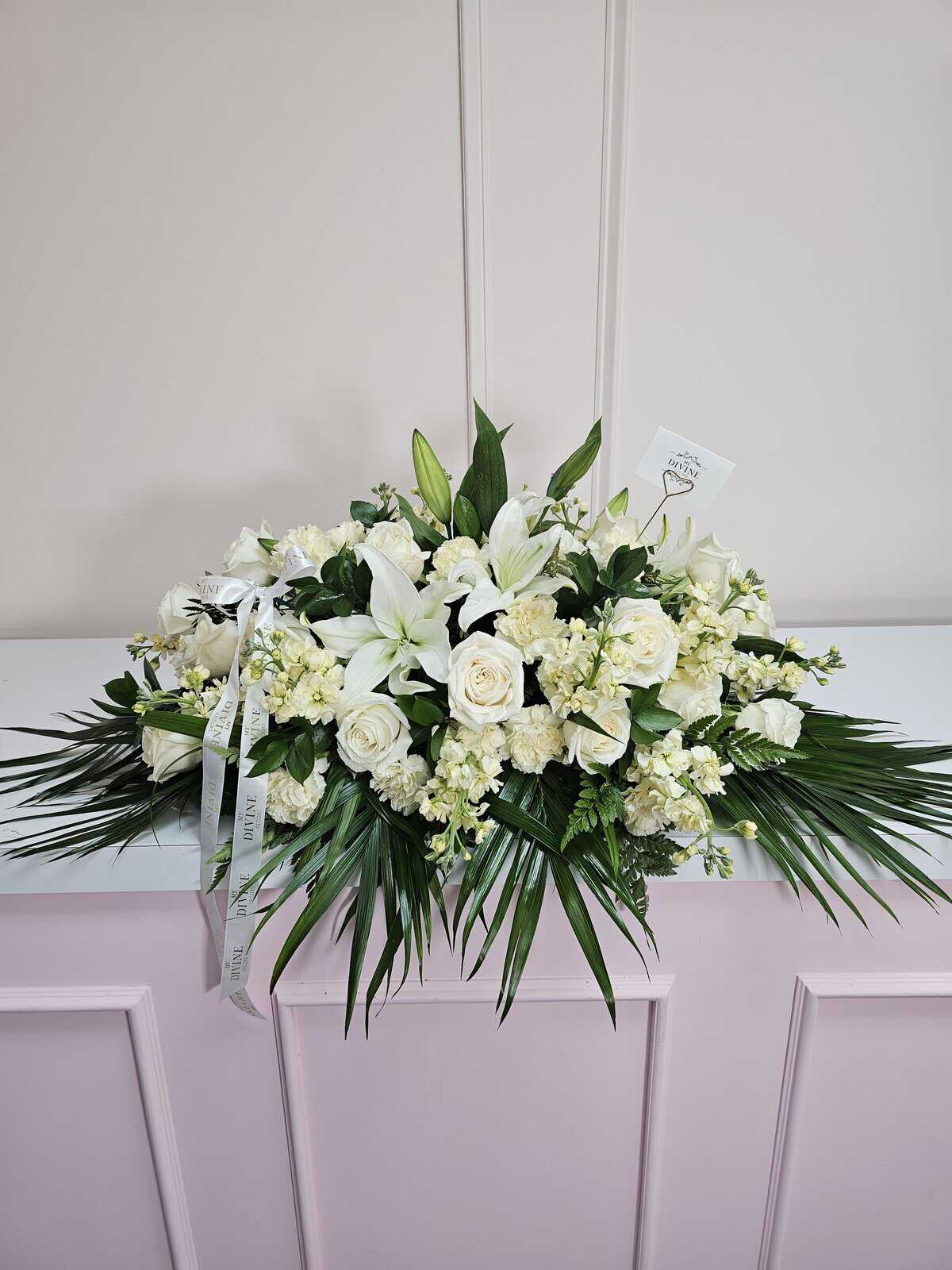 elegant-funeral-spray-casket-1 Elegant Funeral Spray Casket - Image 1