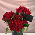 Bold red roses in vase