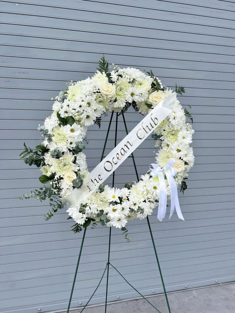 white sympathy flower arrangement delivered in Miami