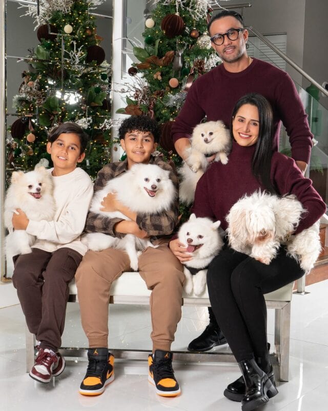 The Ramirez-Nunez family with their dogs at Christmas