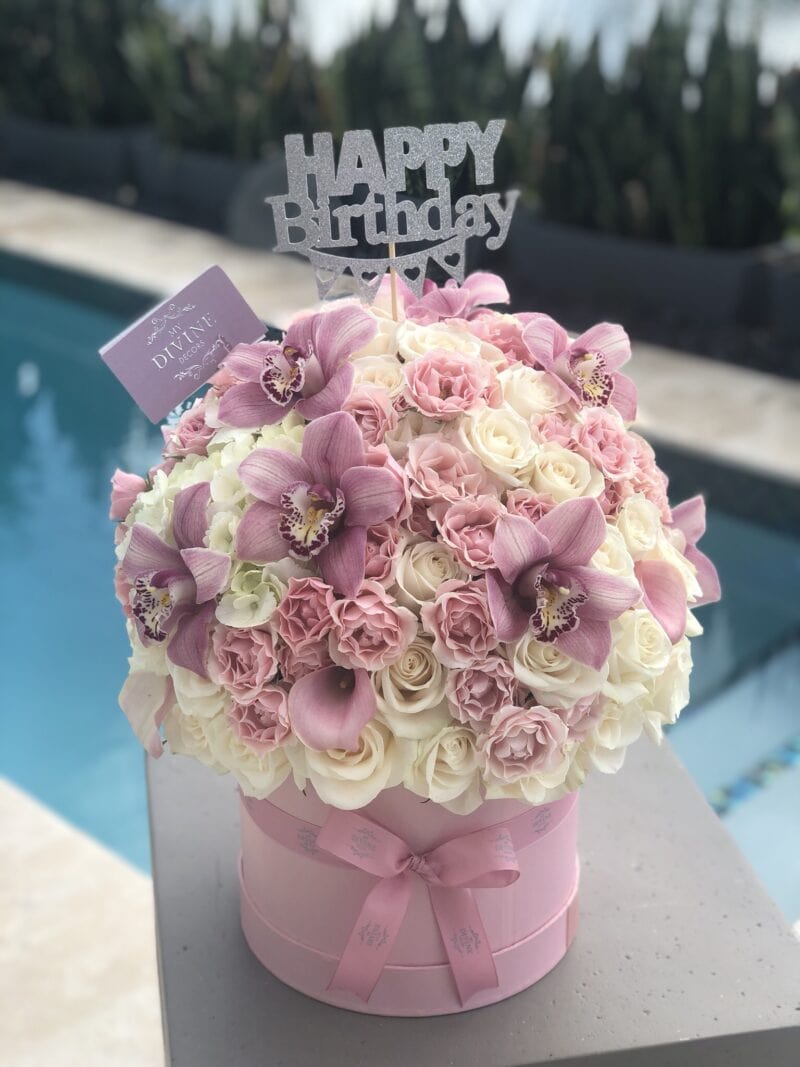 Pink and white birthday flower box with cymbidium orchids by My Divine Decors