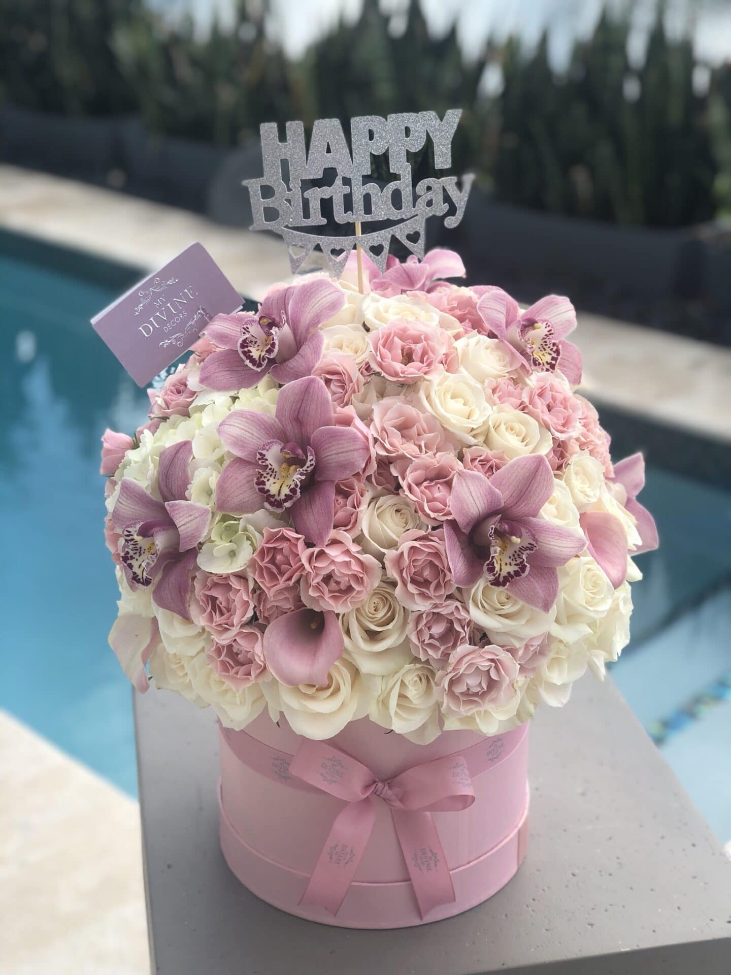 Pink and white birthday flower box with cymbidium orchids by My Divine Decors
