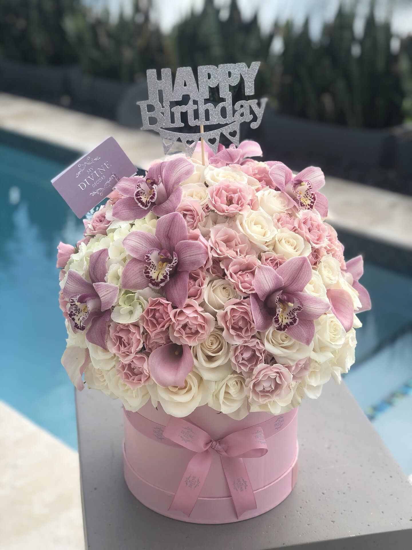 Pink and white birthday flower box with cymbidium orchids by My Divine Decors