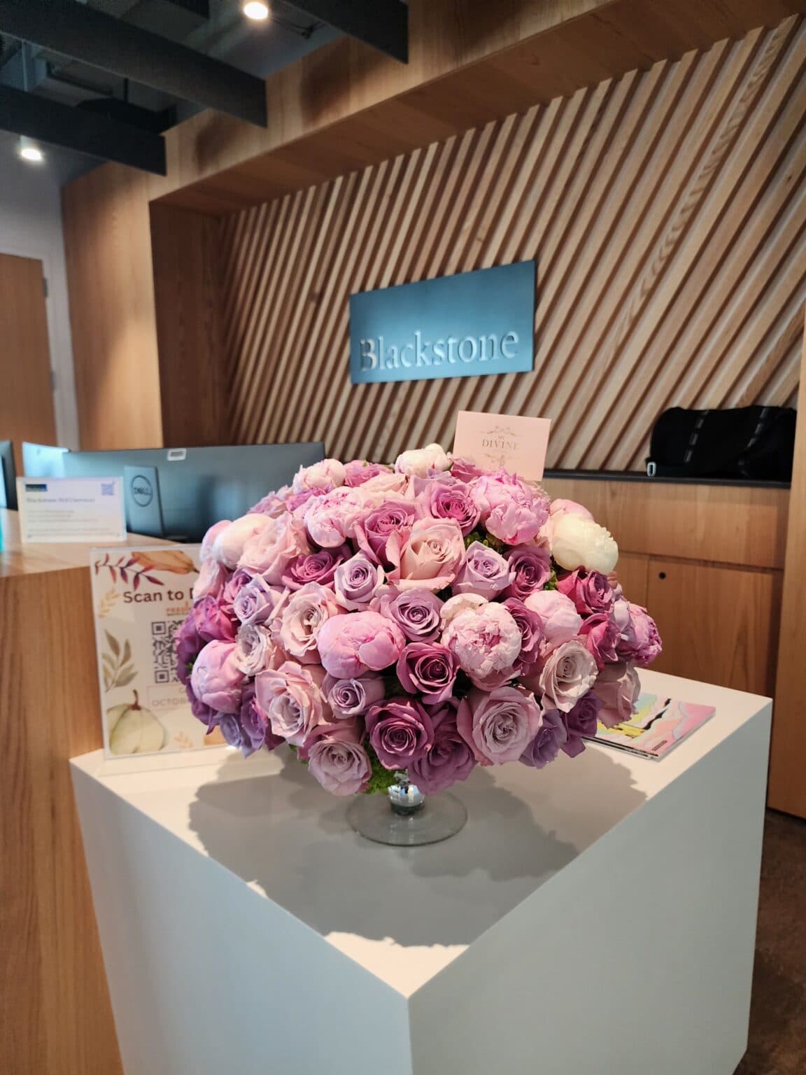 Rose arrangement delivered to an office reception desk
