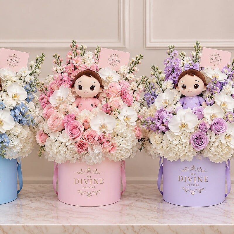 Floral hat box with plush doll in blue, pink and lavender