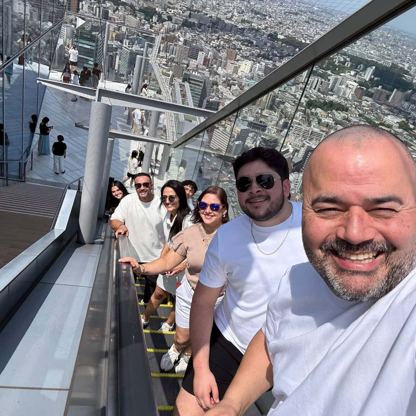 Nelson Ramirez and family on the Shibuya Sky escalator in Tokyo