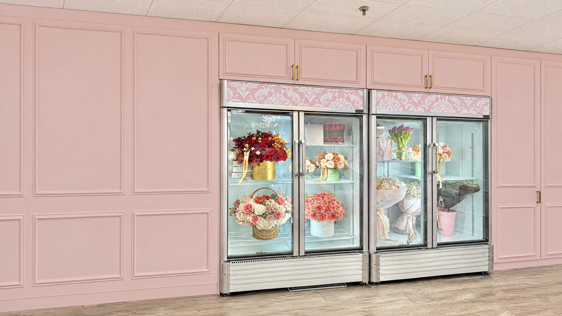 Pink flower coolers filled with rose arrangements inside the My Divine Decors flower boutique in Doral, Miami