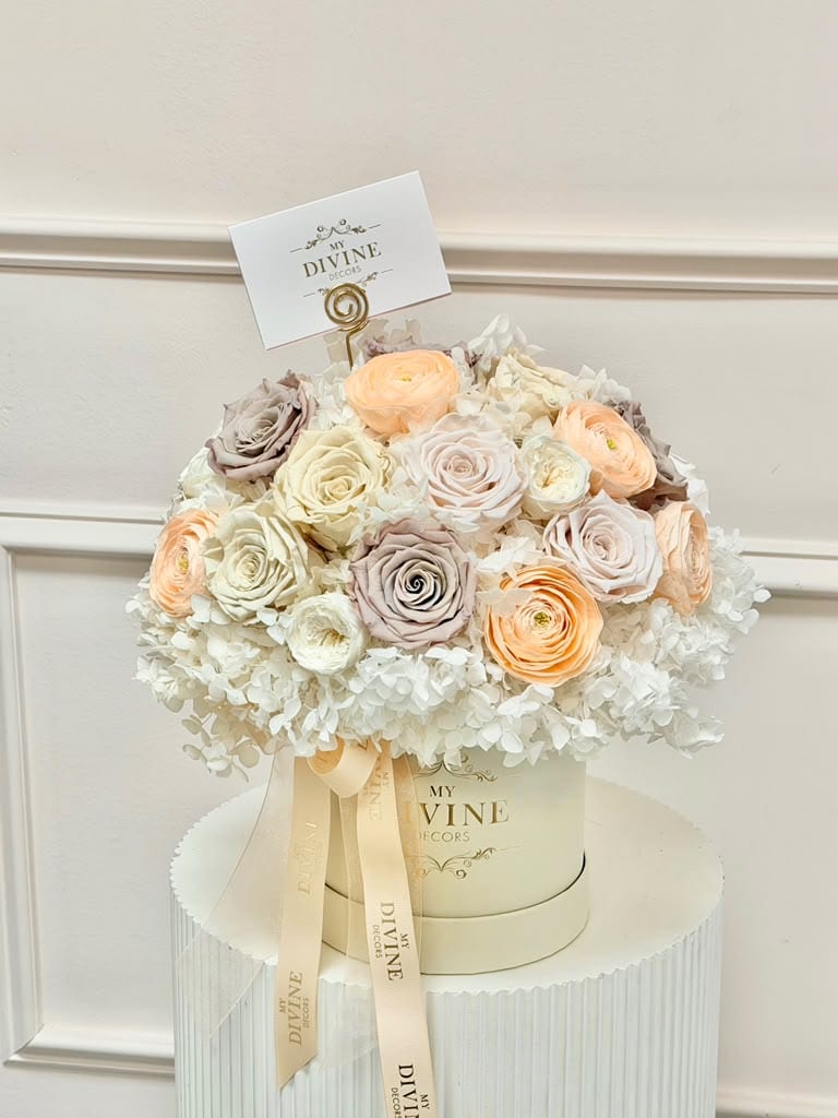Mixed Neutrals Preserved Floral Box Preserved roses and hydrangea in ivory, champagne and blush tones in a cream box
