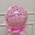 Pink personalized bubble balloon with rhinestones on a My Divine Decors gift box