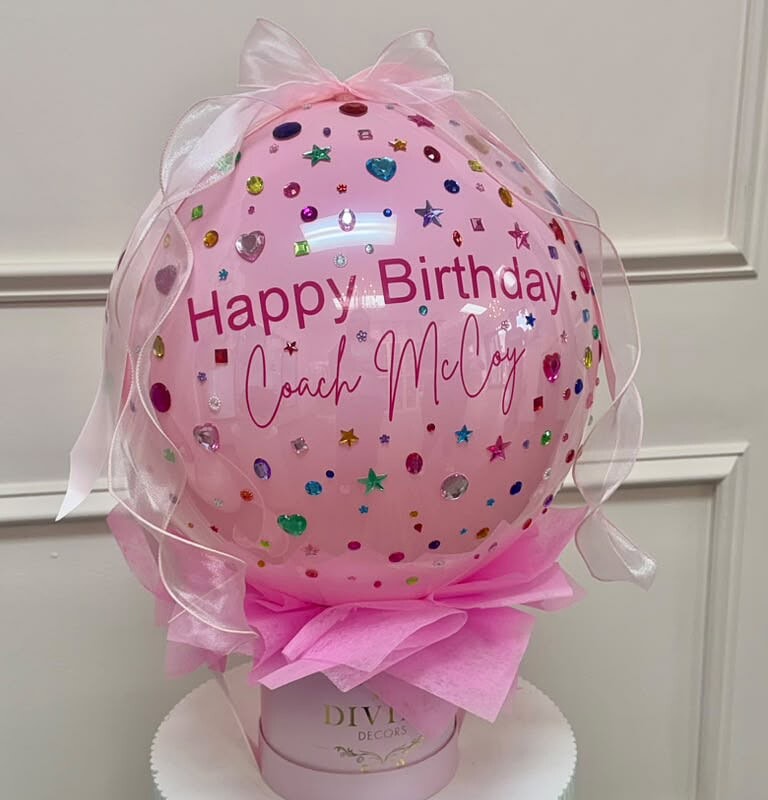 Pink personalized bubble balloon with rhinestones on a My Divine Decors gift box