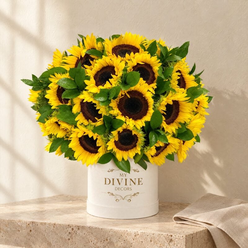 Sunflower Box by My Divine Decors in a white hat box on a travertine console, morning light