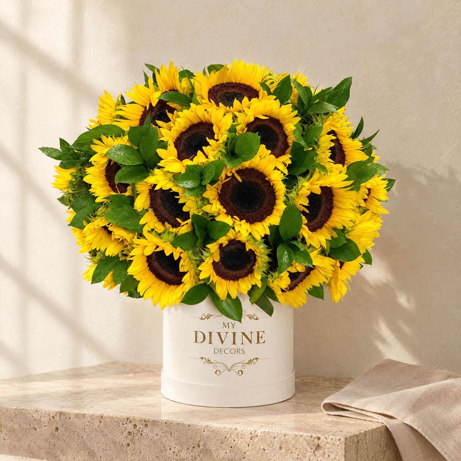 Sunflower Box Sunflower Box by My Divine Decors in a white hat box on a travertine console, morning light