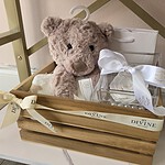 Wooden baby crate with snug teddy bear, blanket and white preserved rose in acrylic box