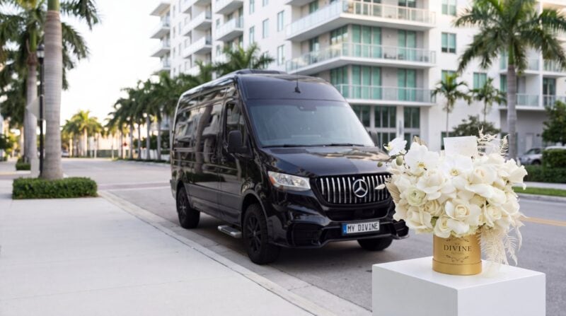 My Divine Decors delivery van and Celine flower box in front of a residential building in Downtown Doral