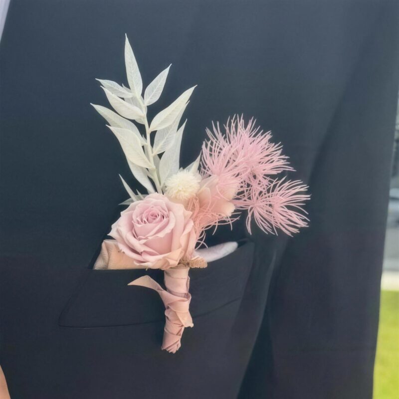 Preserved blush rose boutonniere with pink and white dried accents by My Divine Decors