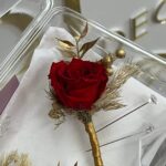 Red rose boutonniere with gold accents and its pin, by My Divine Decors