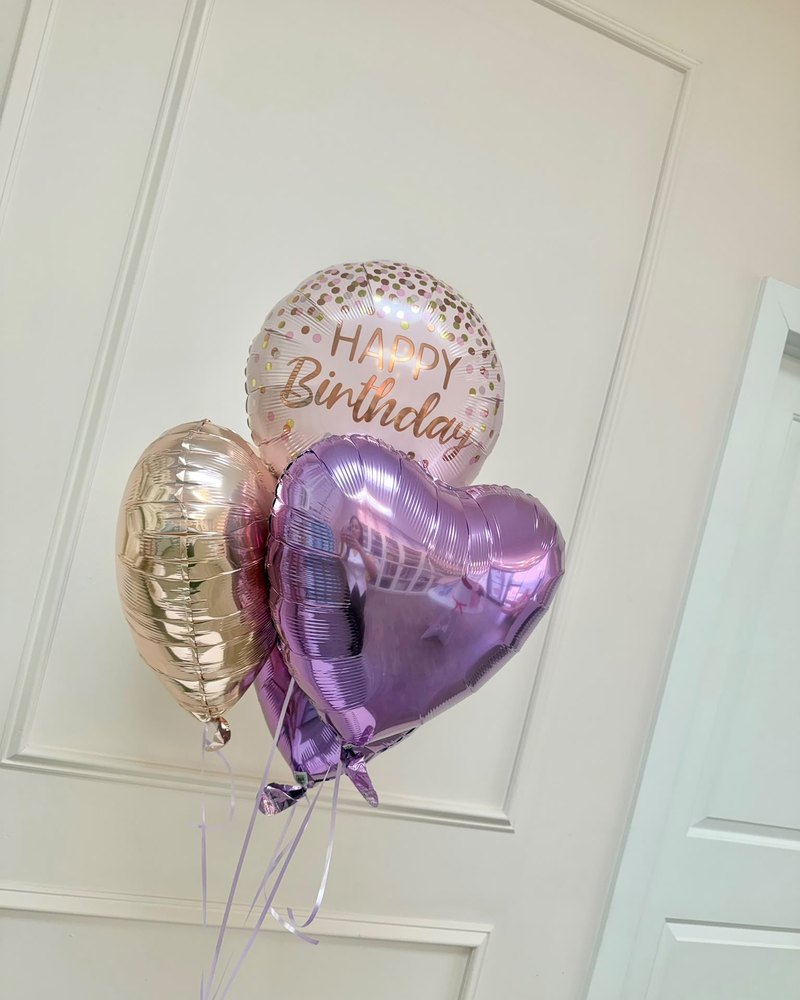 Small foil balloon bouquet with a Happy Birthday orb and champagne and lilac hearts