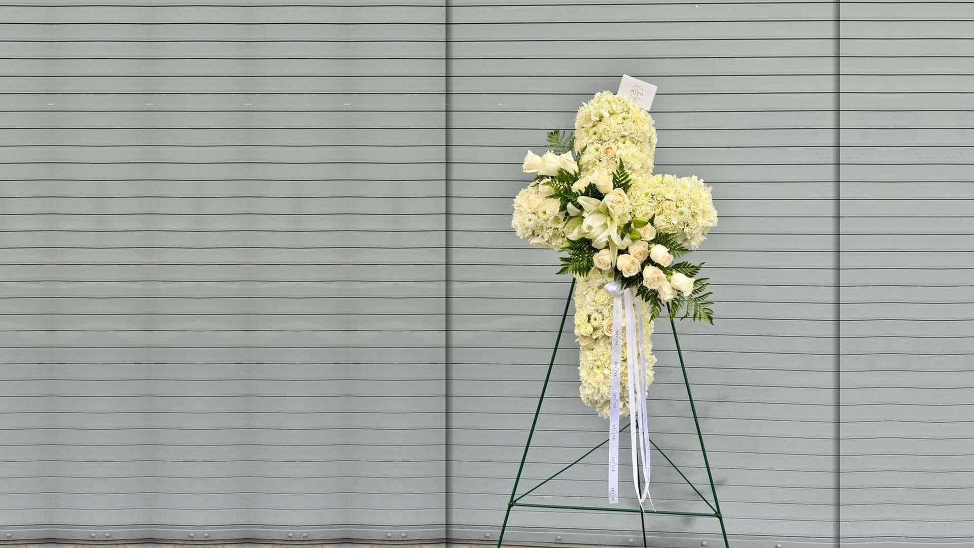 Eternal Grace Cross by My Divine Decors: ivory roses, lilies and carnations on a standing easel