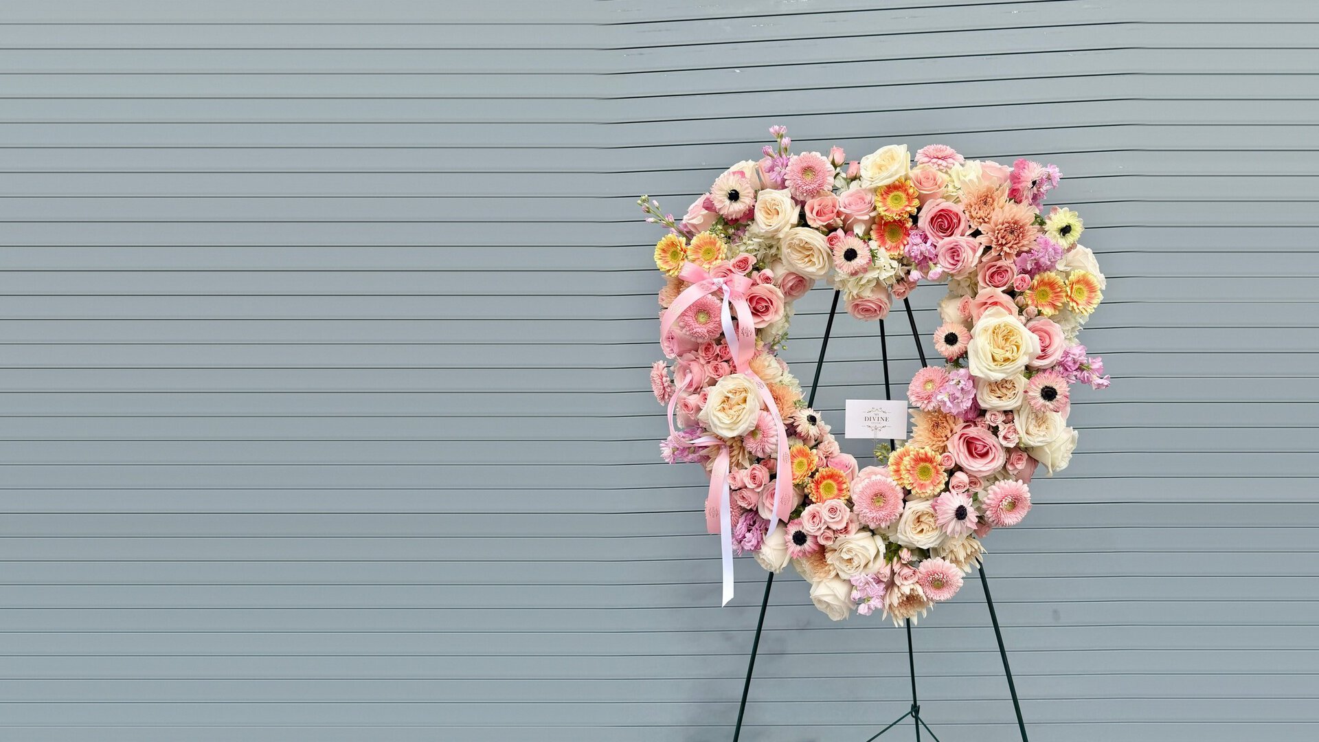 Condolences Heart Wreath by My Divine Decors: open heart of blush roses, gerberas and anemones on a standing easel