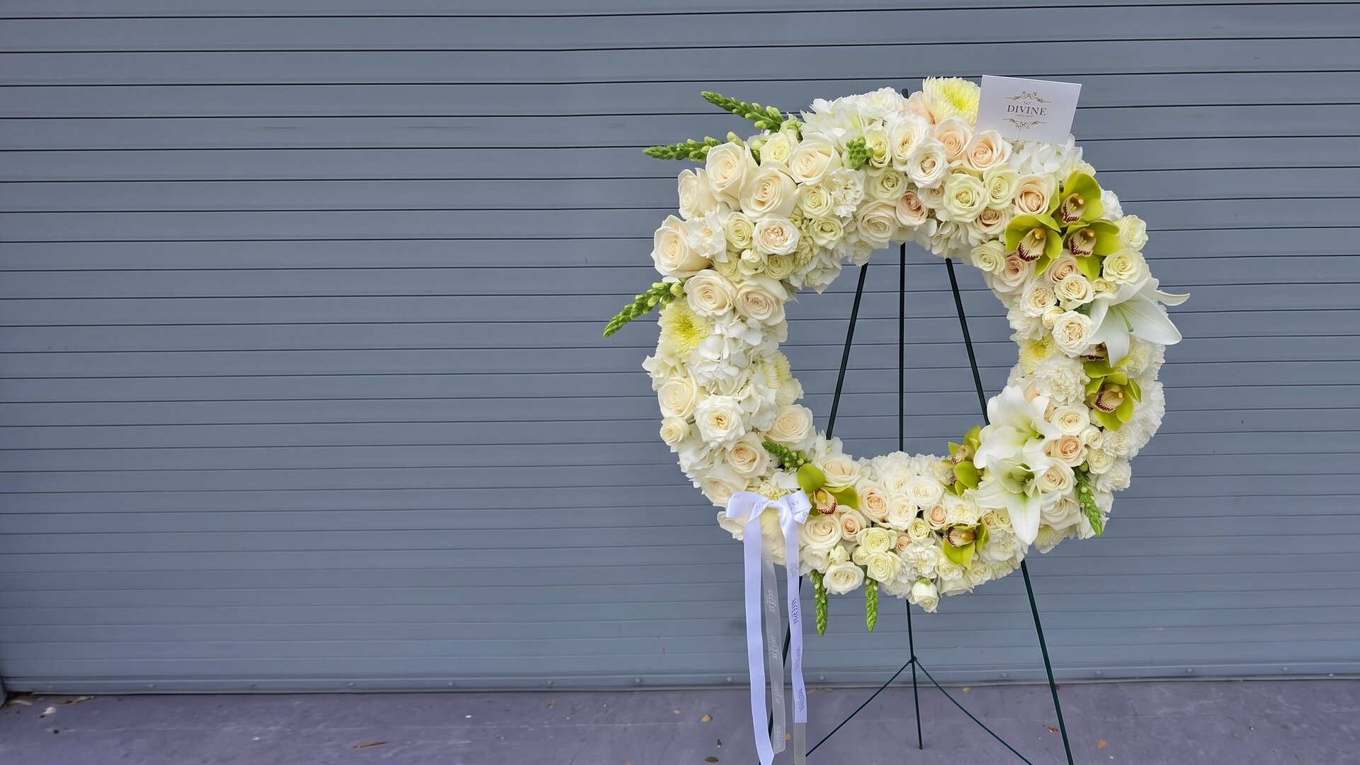 The Royal Ivory Wreath by My Divine Decors: ivory roses, hydrangeas and cymbidium orchids on a standing easel