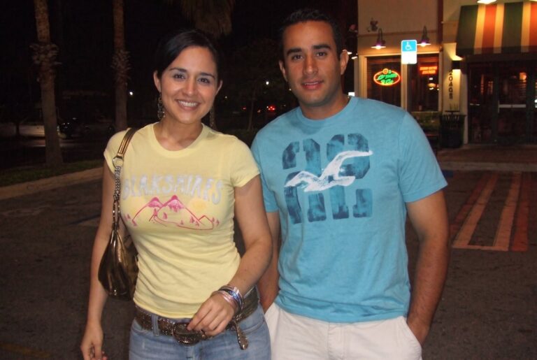 Jessica and Nelson walking together at night