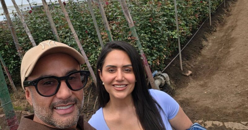 Jessica and Nelson of My Divine Decors among rows of long-stem roses at J&M Flowers, Ecuador