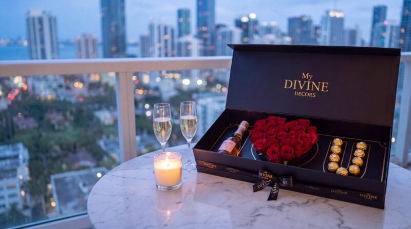 I Love You Gift Box by My Divine Decors with a heart of red roses, Ferrero Rocher chocolates and rose champagne on a Brickell terrace at night