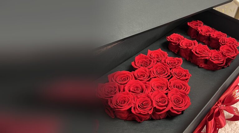 Valentines Preserved I Love You Box by My Divine Decors, a heart and the letter U in red preserved roses inside a black box with a red ribbon