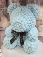 Osito pom pom azul bebé con cinta negra My Divine Decors en cilindro transparente