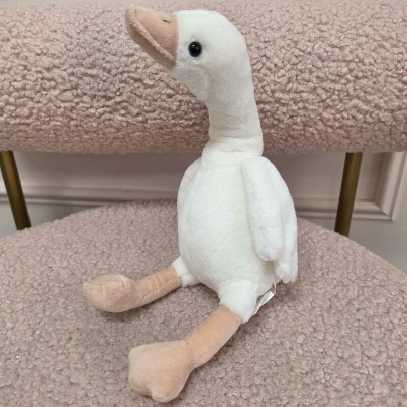 Ganso de peluche blanco con patas largas y pico color durazno