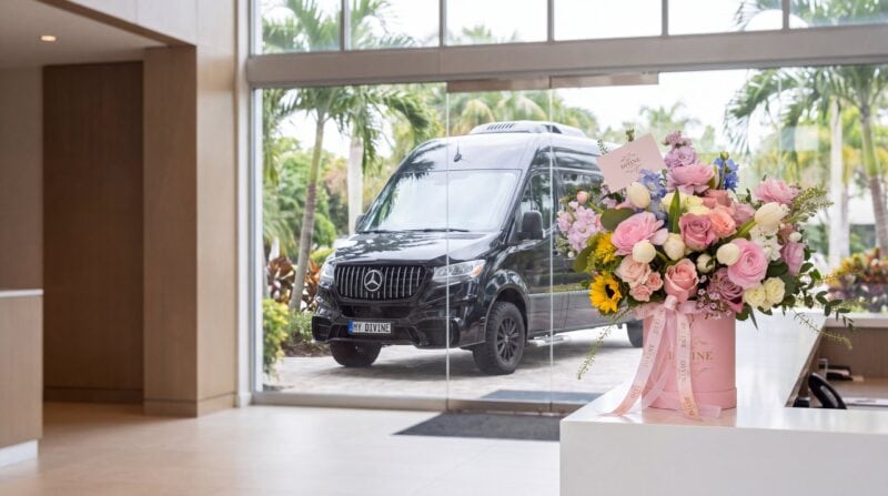 Soft Petals flower box on an office reception desk in Doral with the My Divine Decors van outside