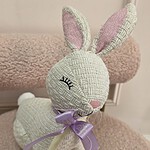Ivory woven texture bunny figure with sleepy eyes and a lilac My Divine Decors ribbon
