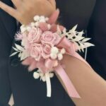Preserved blush rose wrist corsage with pampas and a pink ribbon by My Divine Decors