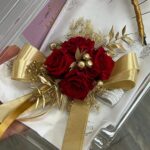 Red rose wrist corsage with gold ribbon and gold berries by My Divine Decors